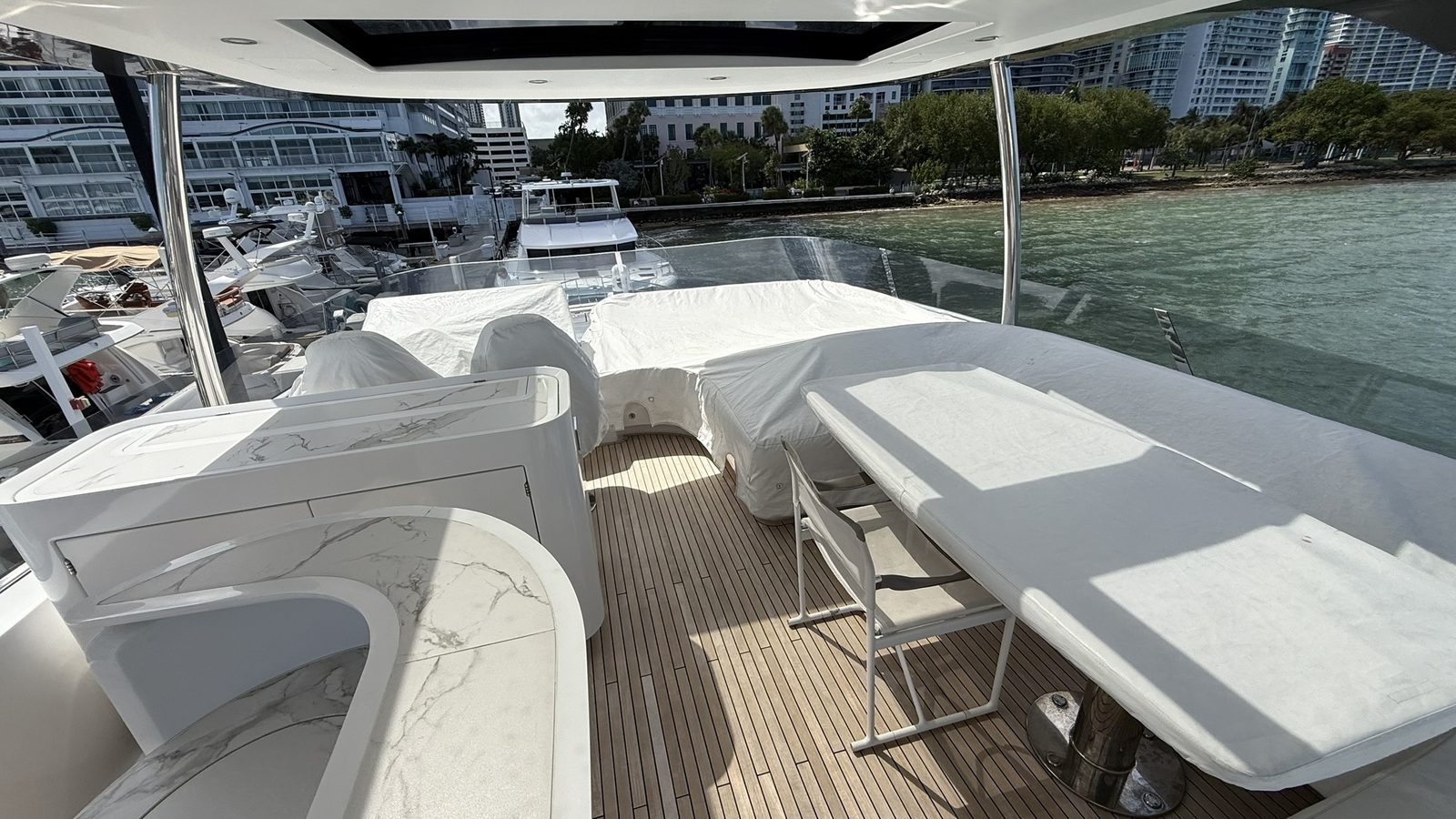Finished flybridge with clean teak deck and polished surfaces