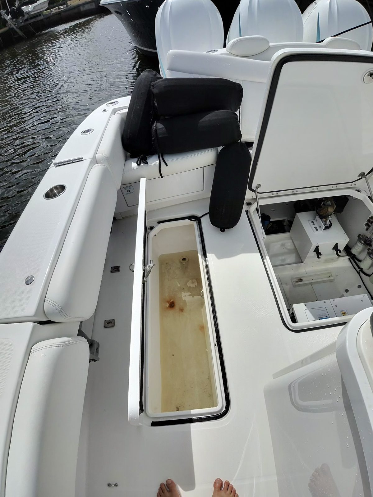 Grimy, water-stained storage compartment before cleaning