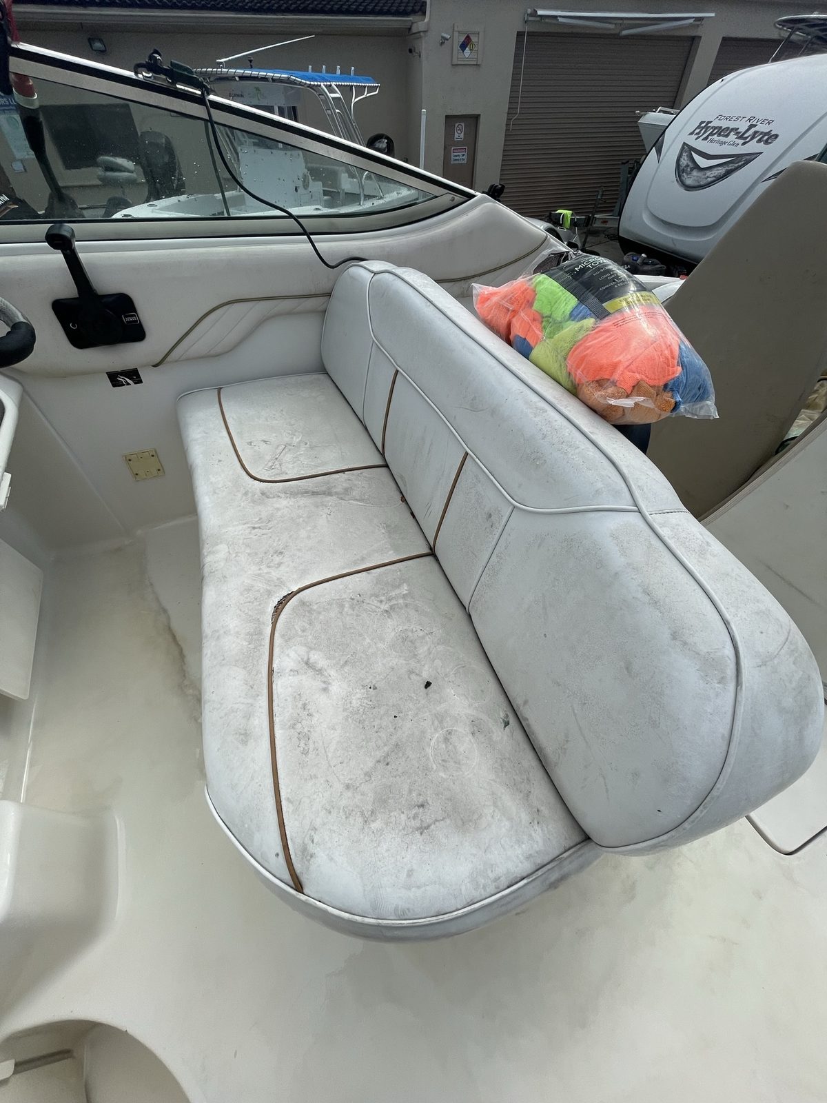 Stained, dirty white boat seating before detailing