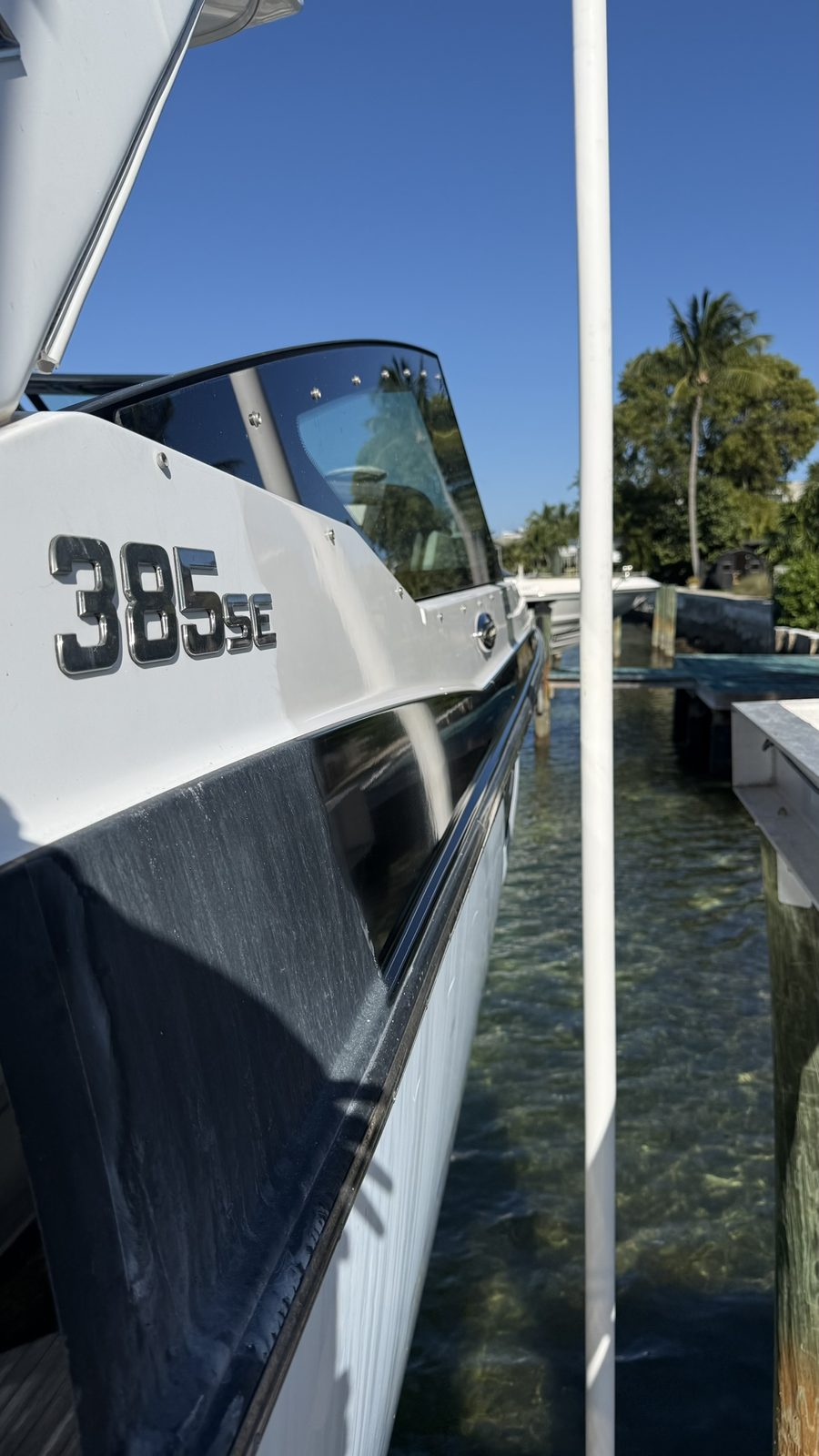 Glossy finished hull registration numbers on a polished boat
