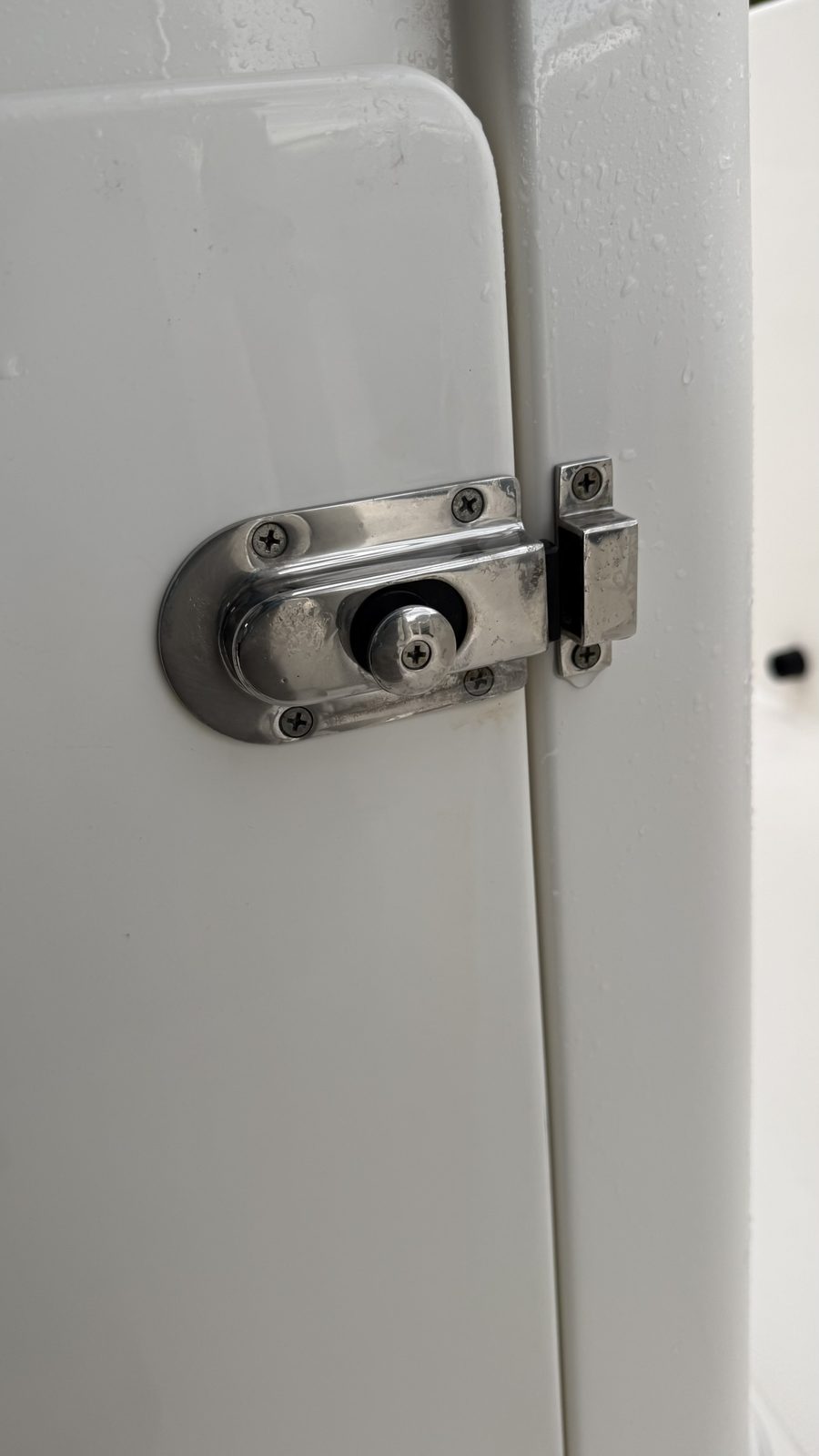 Polished mirror-finish boat door latch after service