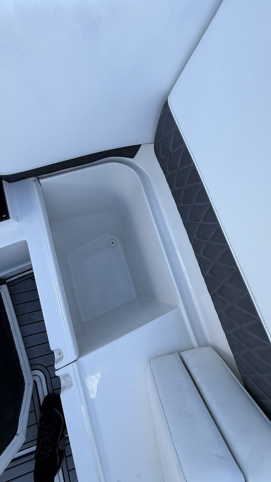 Clean white storage compartment after detailing